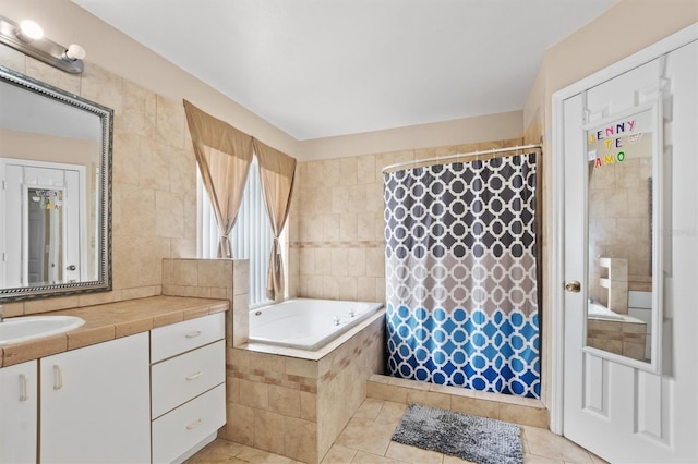 bathroom featuring plus walk in shower, vanity, tile patterned floors, and tile walls