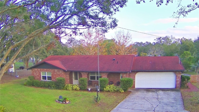 single story home with a front yard and a garage