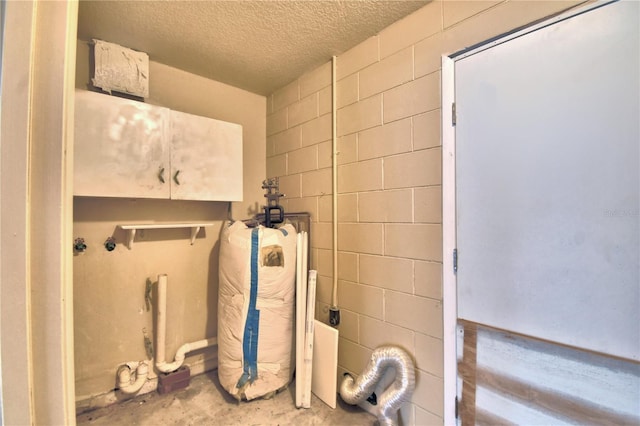 bathroom featuring concrete flooring and a textured ceiling