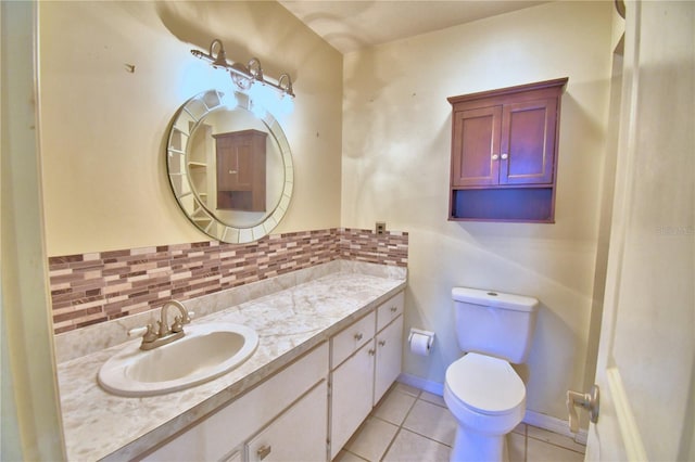 bathroom with tile patterned floors, vanity, and toilet