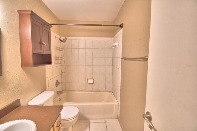 full bathroom with tile patterned floors, tiled shower / bath combo, toilet, and vanity