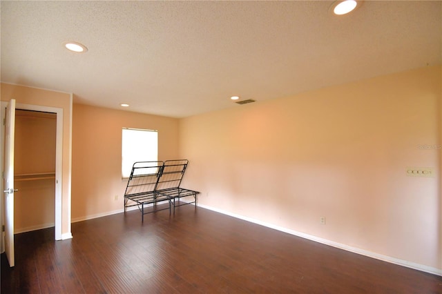 unfurnished room featuring dark hardwood / wood-style floors