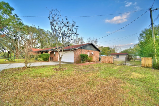 view of property exterior with a yard and a garage