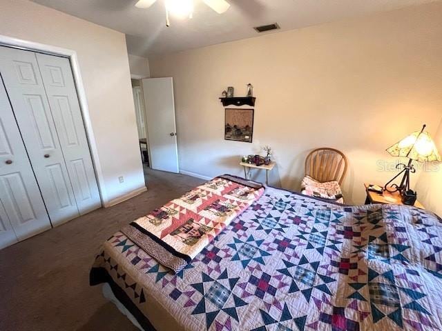 bedroom with carpet, ceiling fan, and a closet