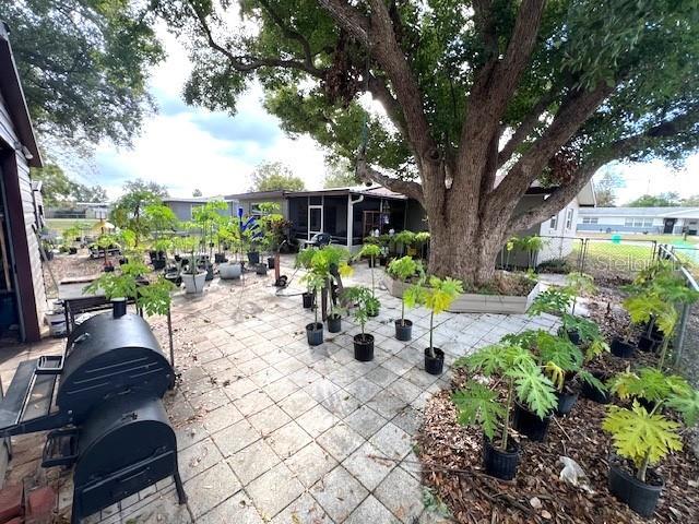 view of patio with a sunroom