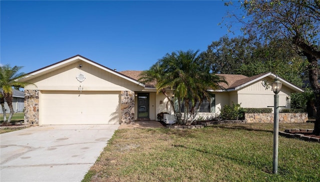 single story home featuring a garage and a front yard