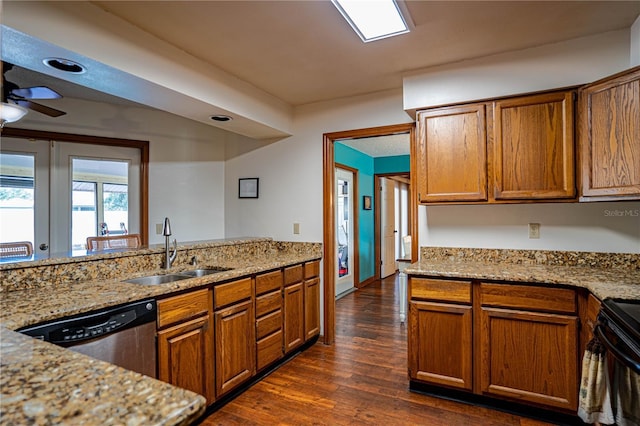 kitchen featuring sink, stainless steel dishwasher, dark hardwood / wood-style floors, ceiling fan, and light stone countertops