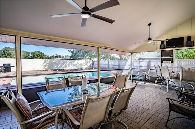 sunroom with vaulted ceiling and ceiling fan