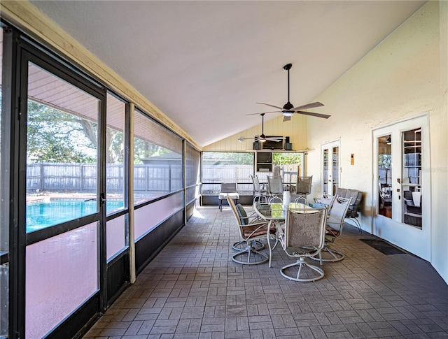 sunroom featuring french doors, vaulted ceiling, and ceiling fan