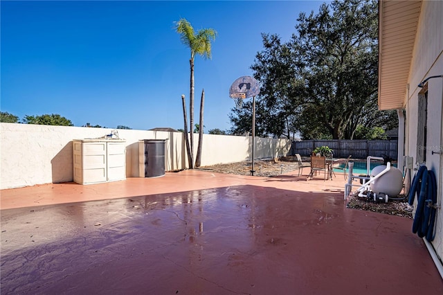 view of patio / terrace featuring a fenced in pool