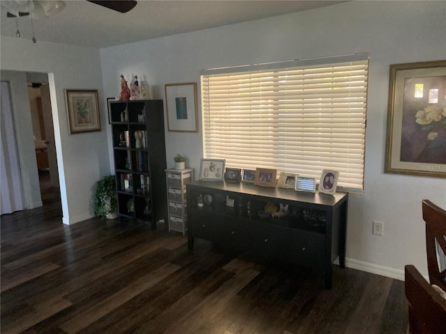 office with ceiling fan and dark wood-type flooring