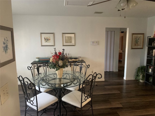 dining room featuring dark hardwood / wood-style flooring and ceiling fan