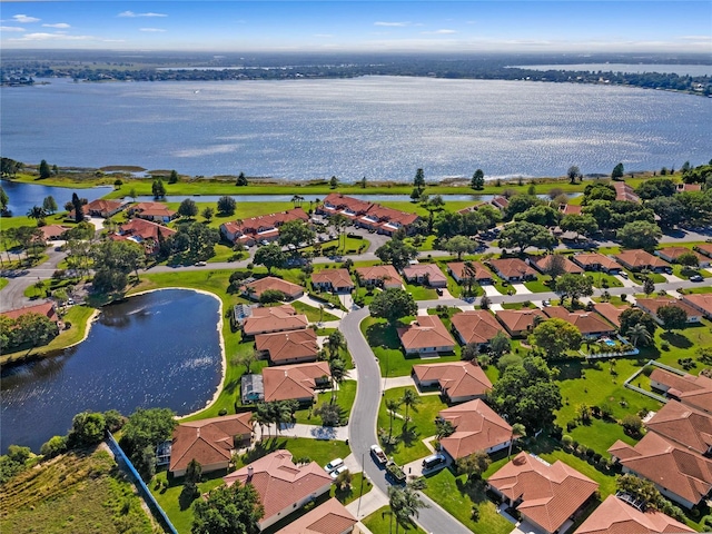 birds eye view of property featuring a water view