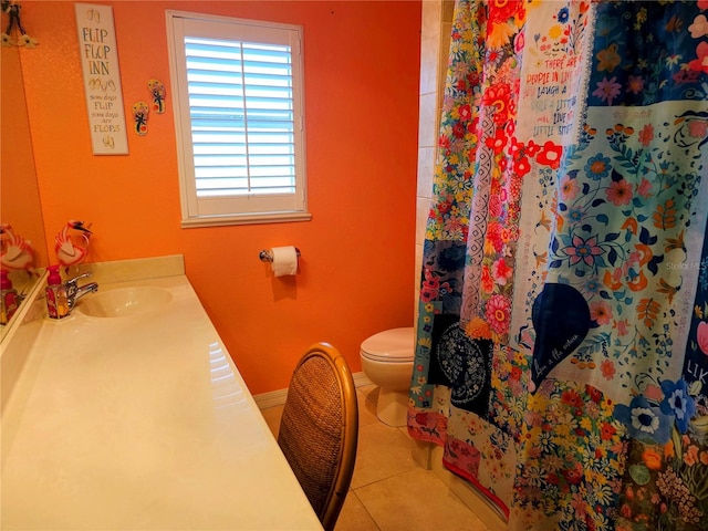 bathroom with tile patterned floors, toilet, sink, and a shower with shower curtain