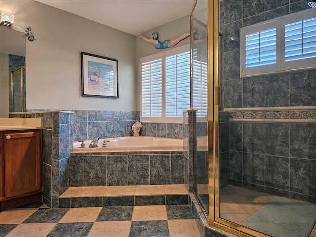 bathroom featuring vanity and separate shower and tub