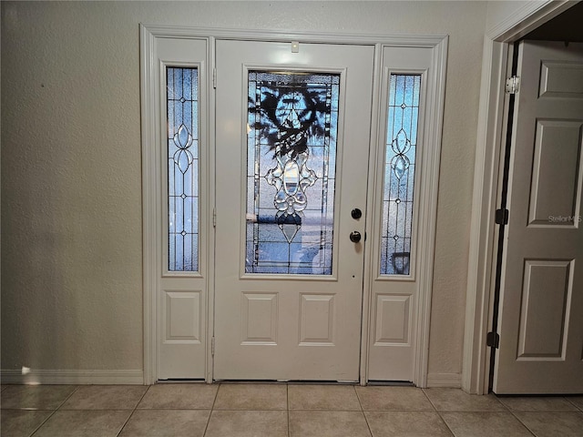 foyer with light tile patterned floors