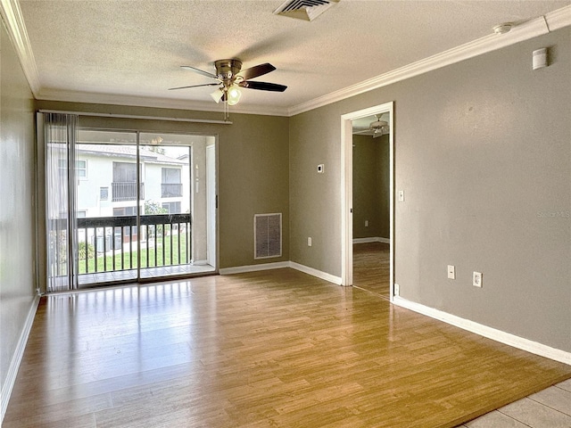 empty room with a textured ceiling, light hardwood / wood-style flooring, ceiling fan, and ornamental molding