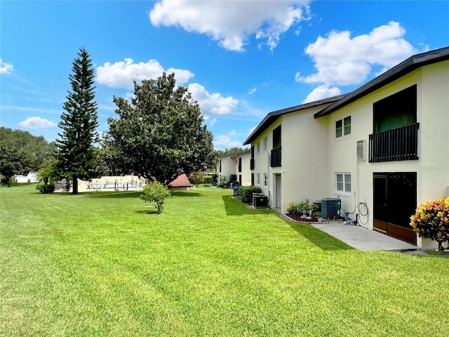 view of yard with central AC