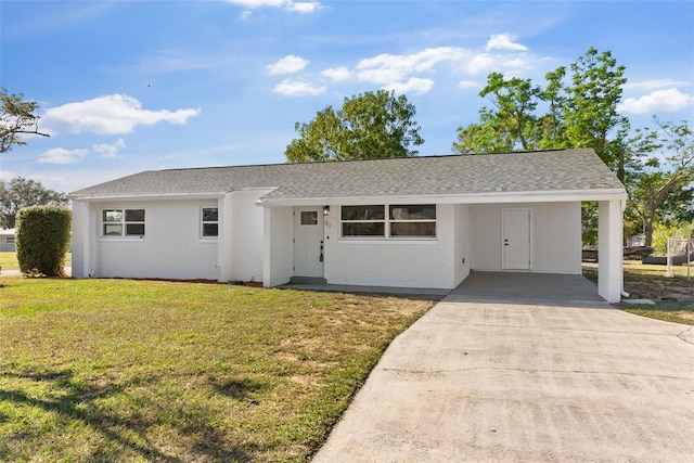 ranch-style house with a carport and a front yard