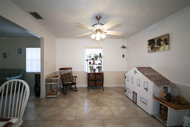 interior space featuring a wealth of natural light, ceiling fan, crown molding, and light tile patterned flooring