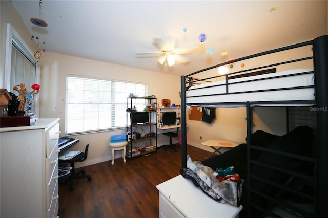 bedroom with dark wood-type flooring