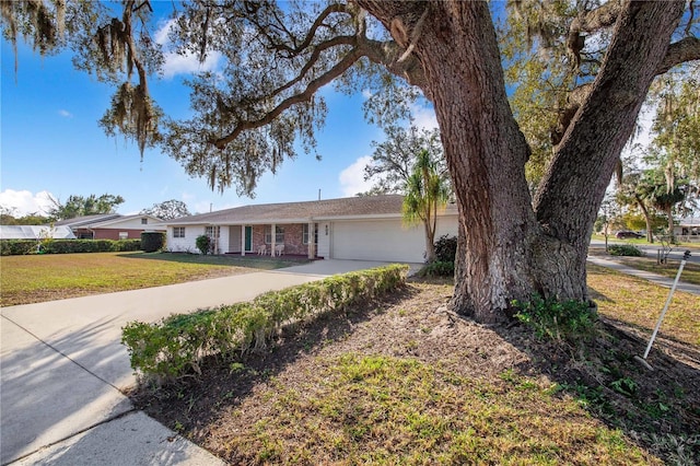 ranch-style house with a garage and a front lawn