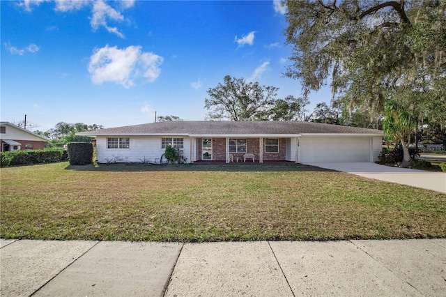 single story home with a garage and a front lawn