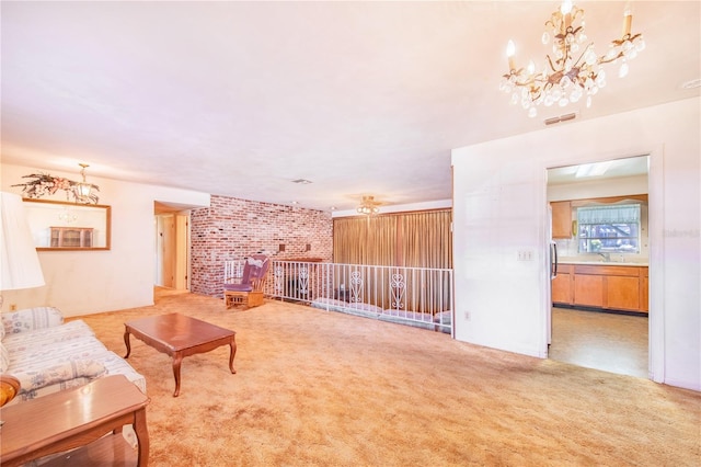 carpeted living room featuring ceiling fan with notable chandelier