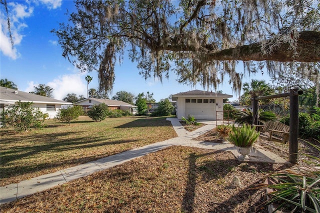 view of front of home featuring a garage and a front lawn