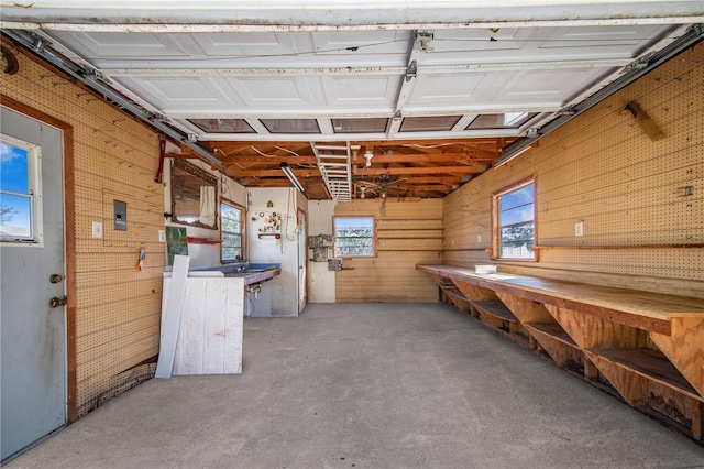 garage featuring wood walls