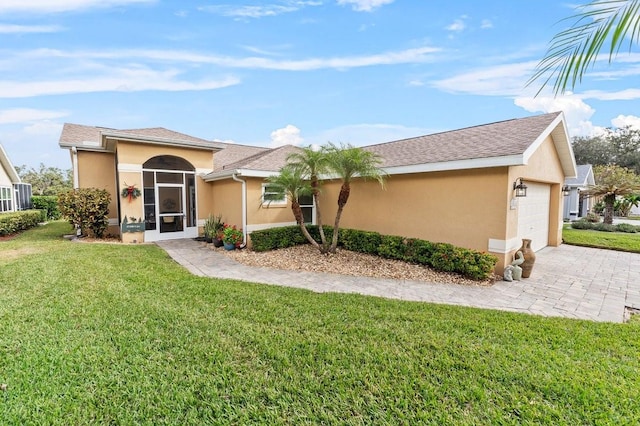 single story home featuring a front yard and a garage