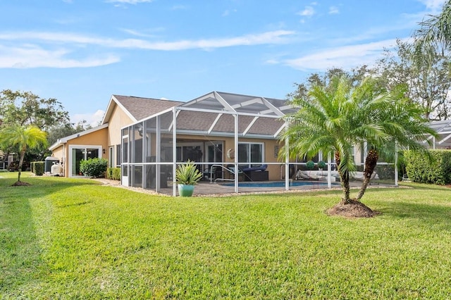 back of house featuring a yard and a lanai