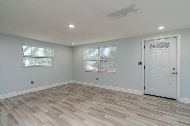 foyer entrance with light hardwood / wood-style floors