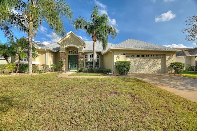 ranch-style home featuring a garage and a front lawn