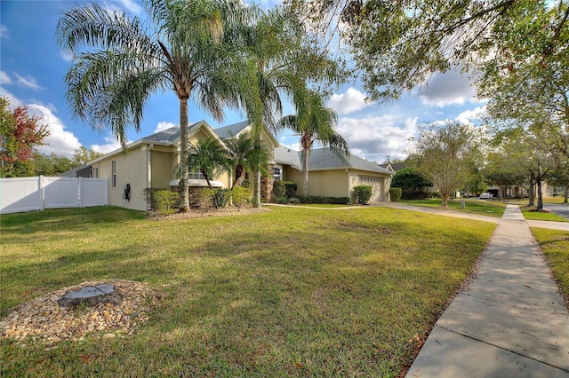 view of front of house with a front lawn and a garage