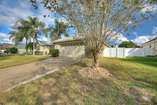 view of front of house with a front yard and a garage