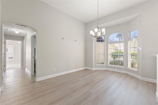 unfurnished room featuring light hardwood / wood-style flooring and a healthy amount of sunlight