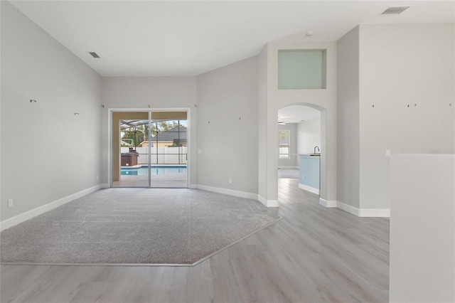 spare room with light wood-type flooring