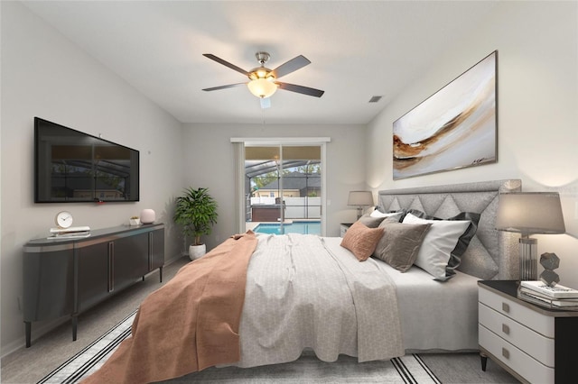 carpeted bedroom featuring access to exterior and ceiling fan