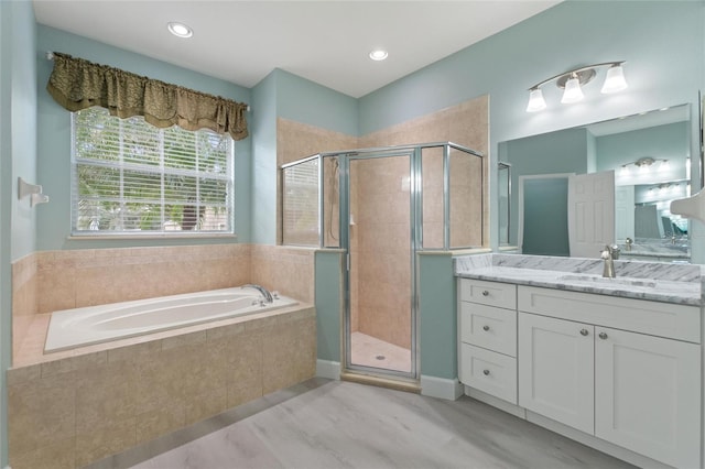 bathroom featuring vanity and plus walk in shower