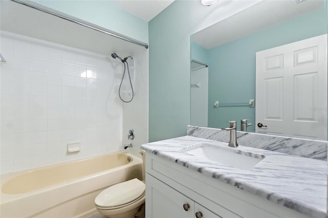 full bathroom featuring vanity, toilet, and tiled shower / bath