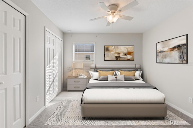 carpeted bedroom featuring ceiling fan