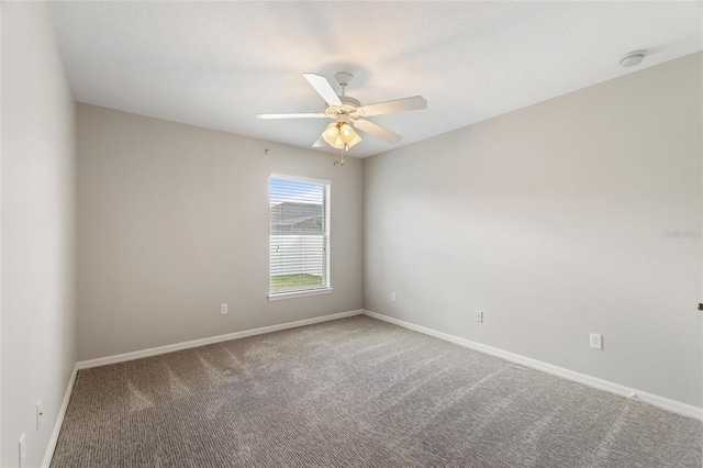 spare room with carpet and ceiling fan