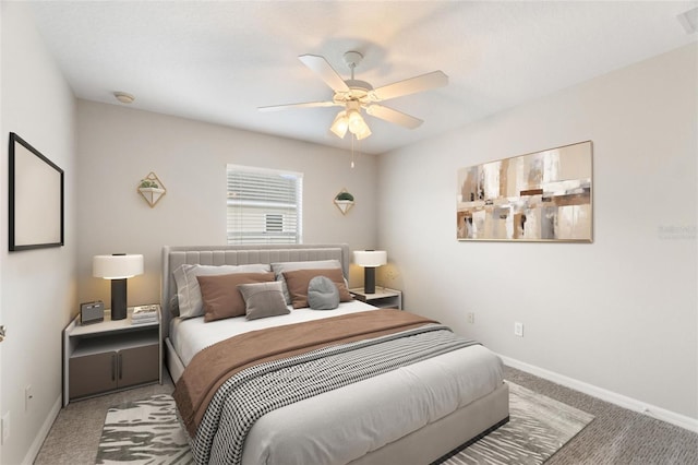 bedroom with ceiling fan and carpet floors