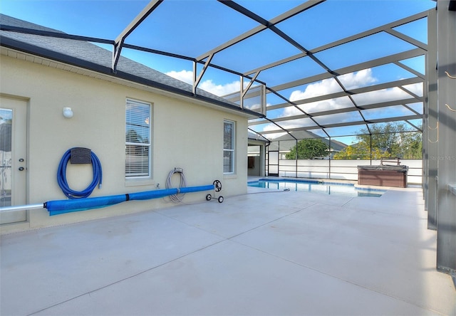 view of pool with a patio area, a lanai, and a hot tub