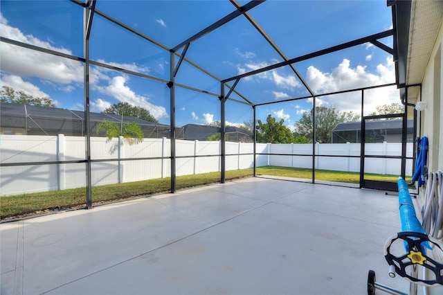 view of patio with glass enclosure