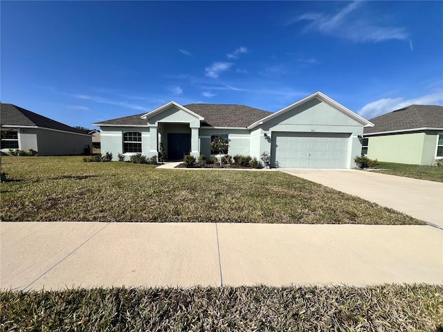 view of front of property featuring a garage and a front lawn