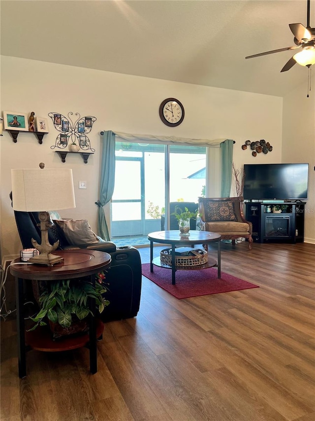 living room featuring ceiling fan and hardwood / wood-style floors