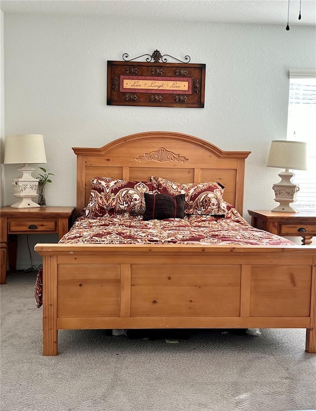 bedroom featuring light carpet