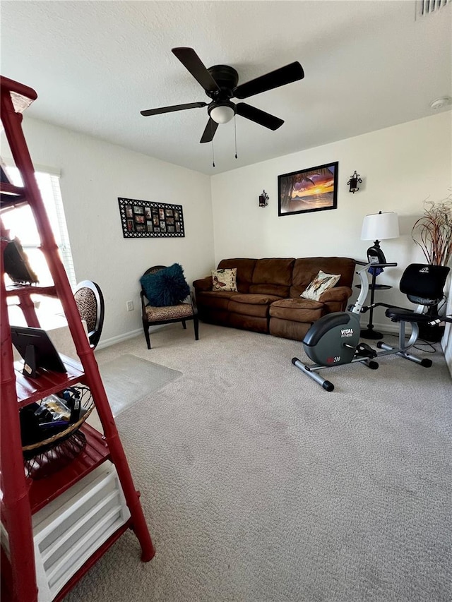 living room with carpet flooring and ceiling fan